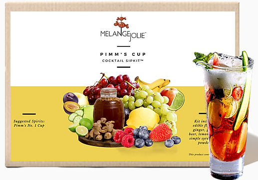 Mélange Jolie Pimm's Cup Cocktail SipKit™ with glass, bar spoon, cocktail sticks, and dehydrated fruits displayed elegantly.